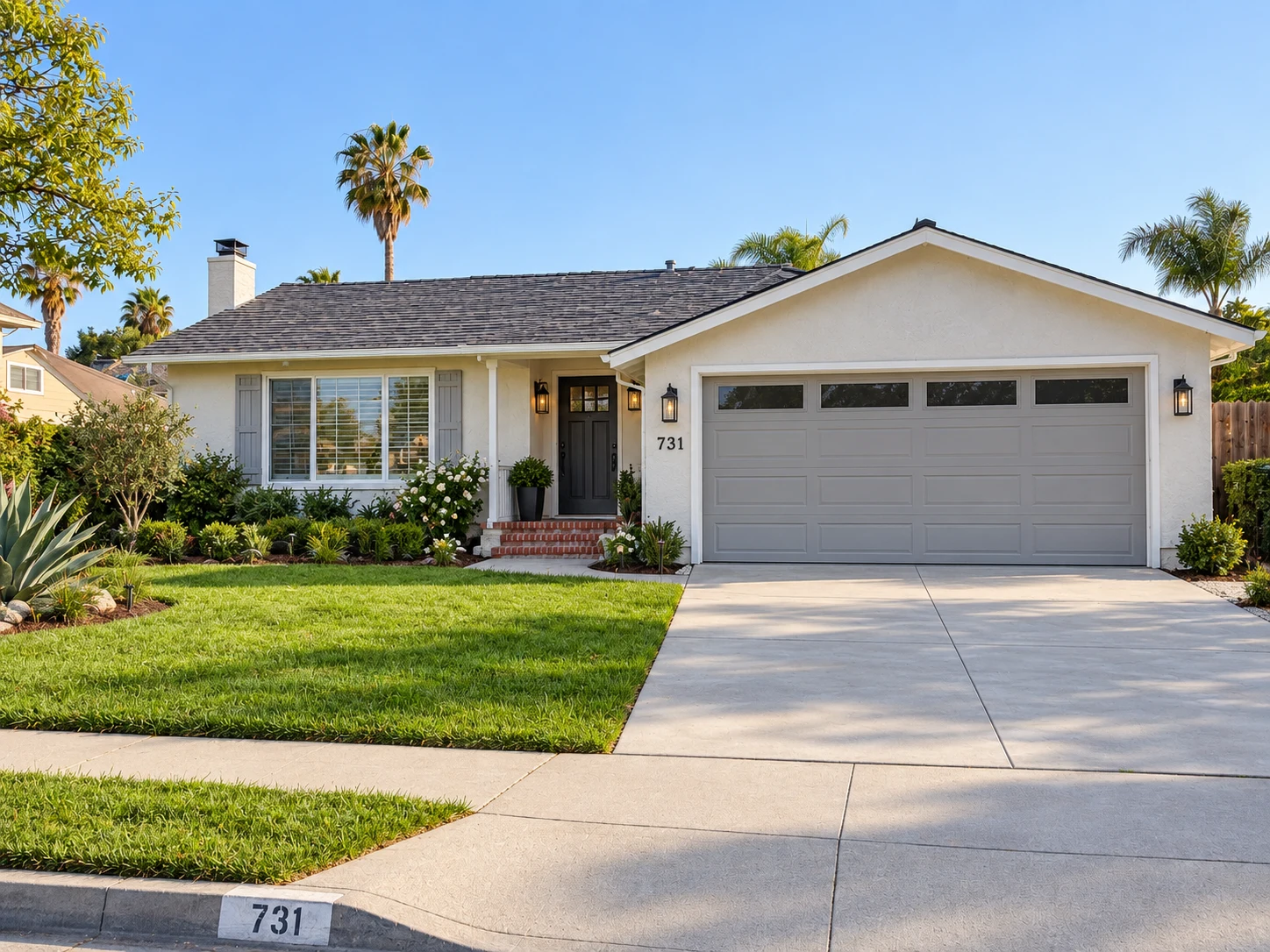 After concept of the same house: renewed cream stucco, a dark roof, a gray garage door, entry lighting and refreshed landscaping